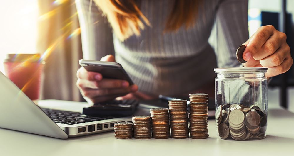 A woman separating Quarters into piles.