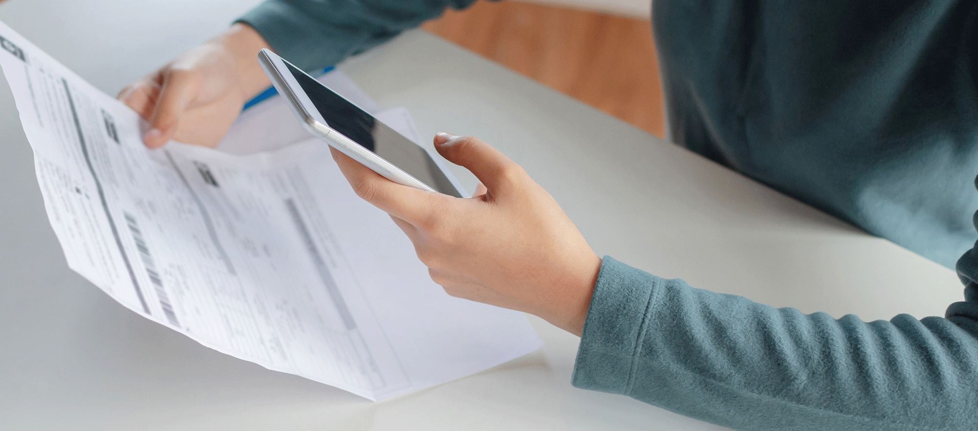 Woman paying bills on her computer